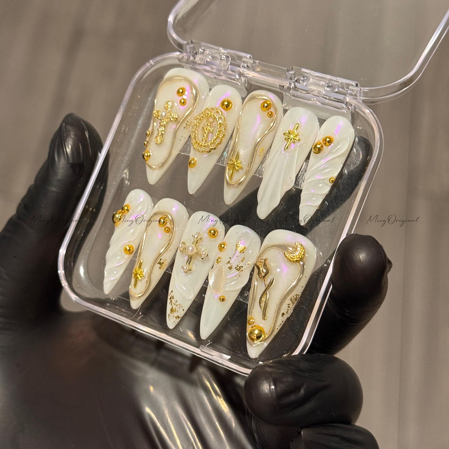 Gold celestial press on nails, iridescent white 3D charm nails with cross, moon, and star accents, luxury handmade nail art set,MO523