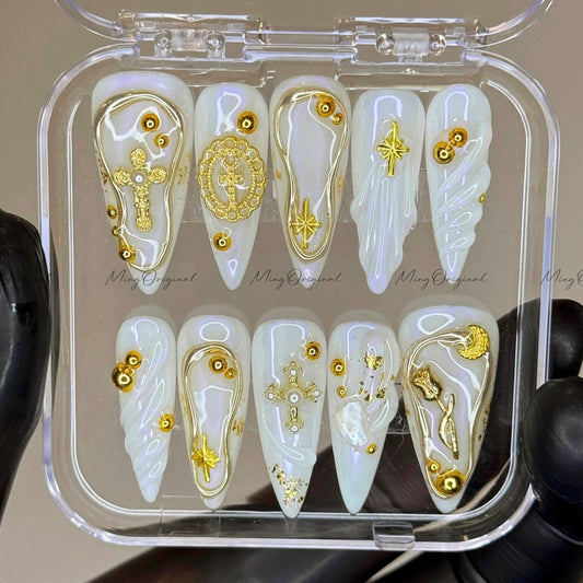 Gold celestial press on nails, iridescent white 3D charm nails with cross, moon, and star accents, luxury handmade nail art set,MO523