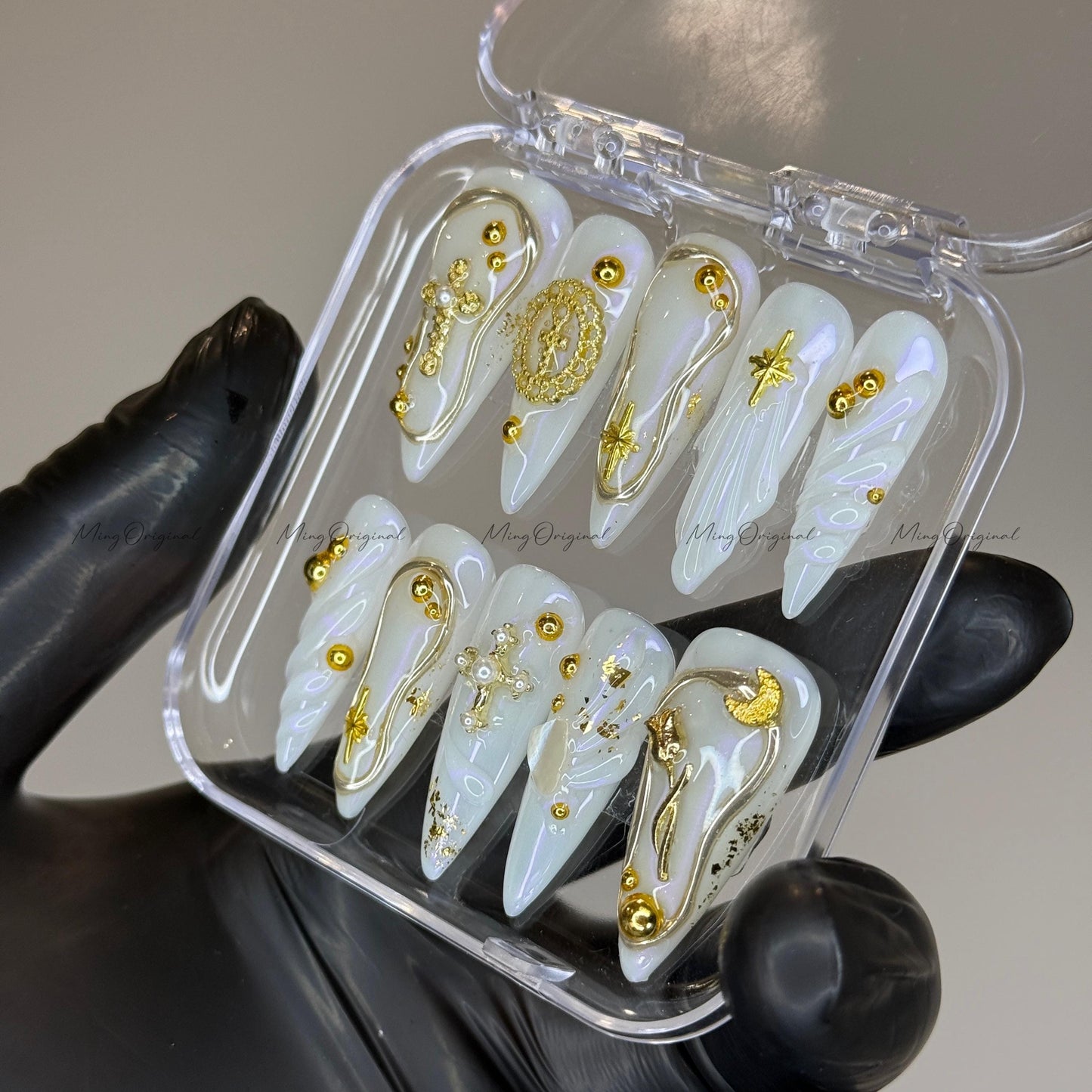 Gold celestial press on nails, iridescent white 3D charm nails with cross, moon, and star accents, luxury handmade nail art set,MO523