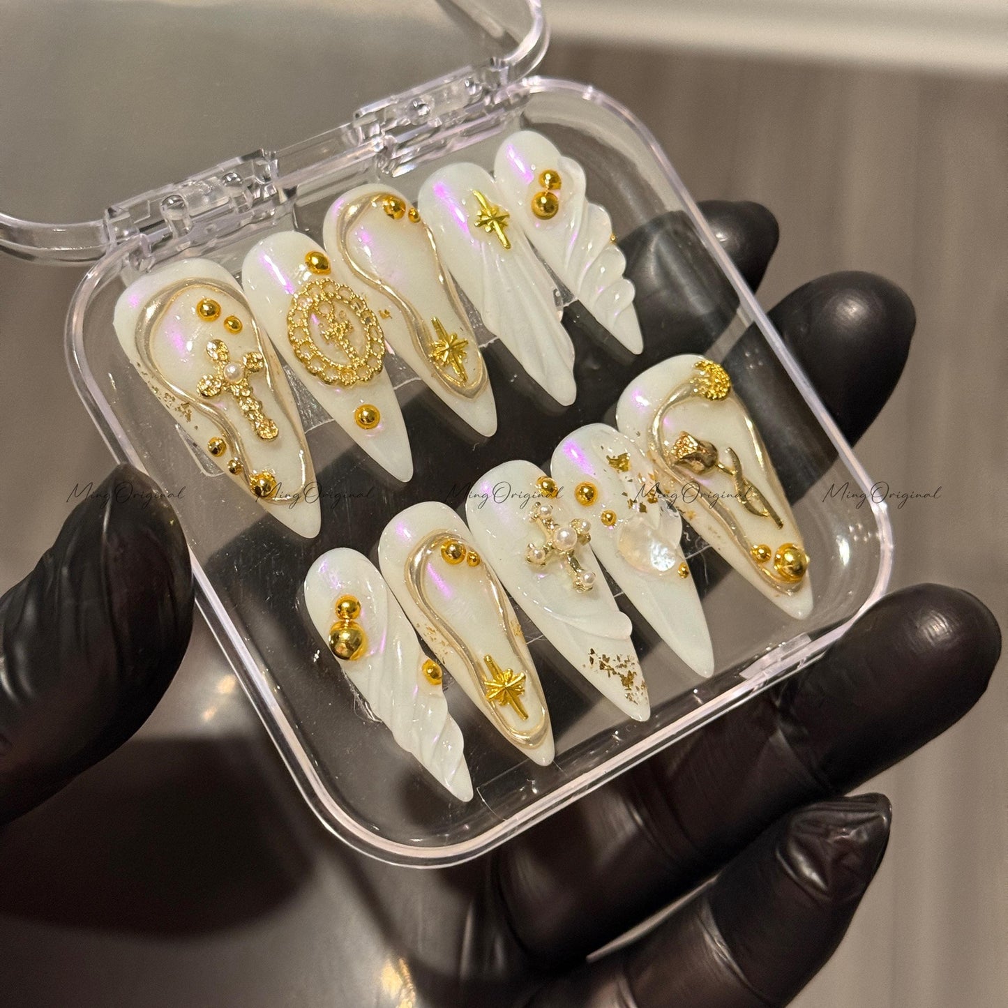 Gold celestial press on nails, iridescent white 3D charm nails with cross, moon, and star accents, luxury handmade nail art set,MO523