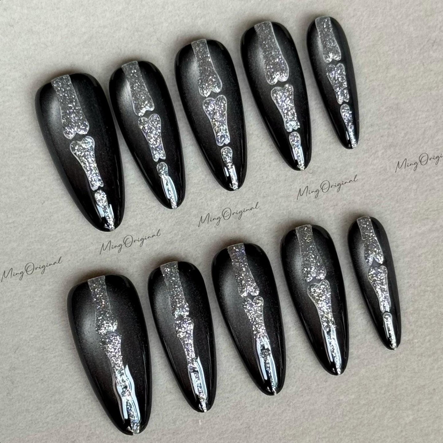 Halloween Shadow Spine Bone press on nails, black cat eye base, silver glitter bone design, spooky season sparkling Gothic nail art, MO615